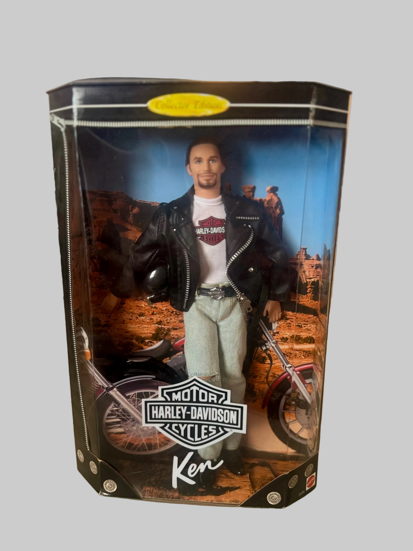 A Ken Hardee action figure of a man on a Harley-Davidson motorcycle, packaged in a clear plastic display box with a printed black, white, and blue front panel.