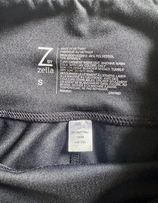 Close-up of Zella clothing with label details on a dark background