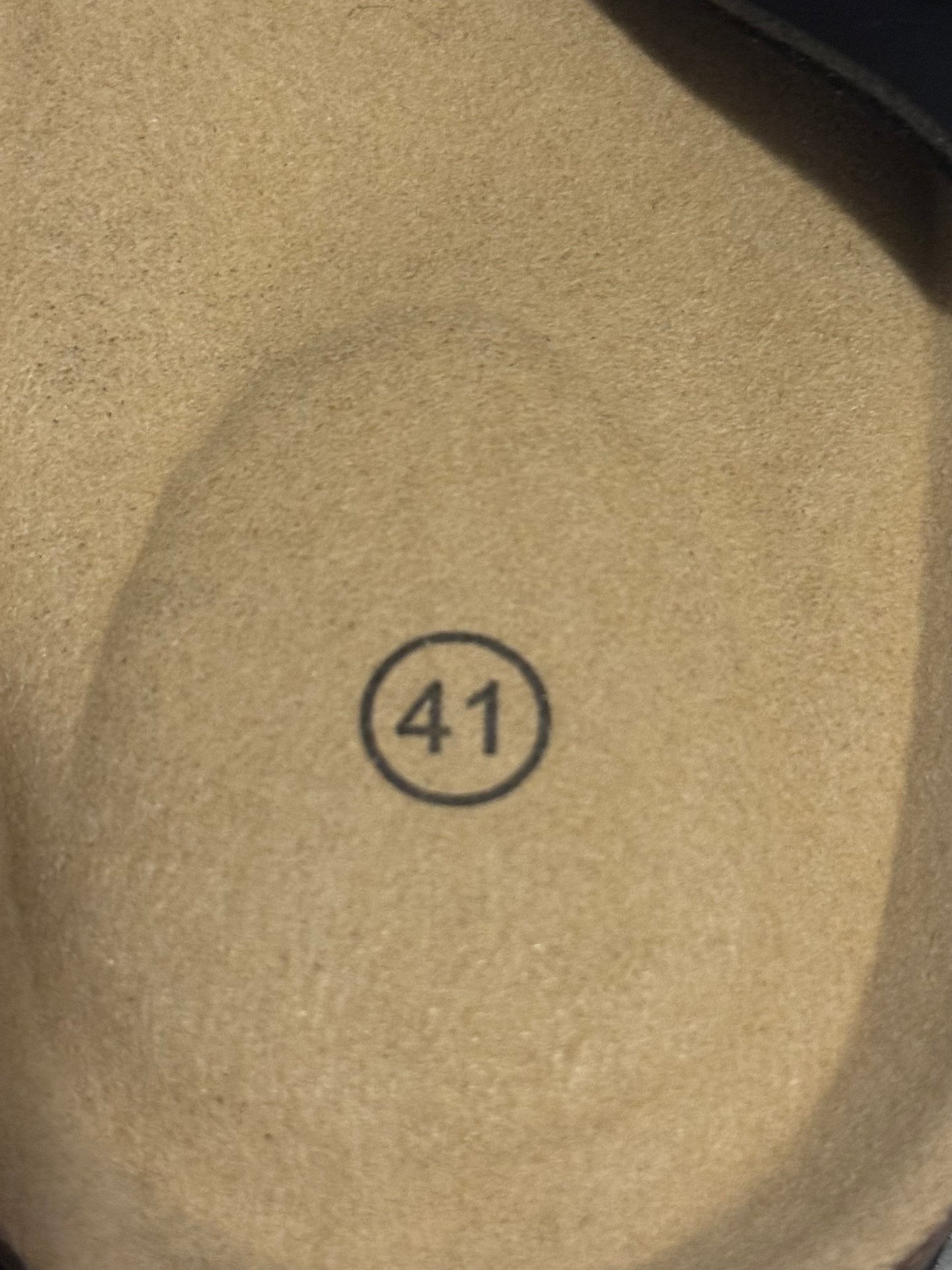 Beige fabric with a number 41 printed on it