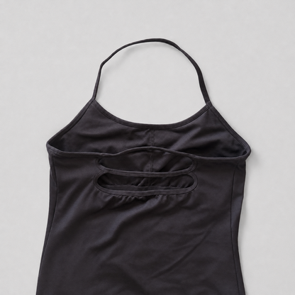 A black sleeveless camisole top with a double-strap back design and a small side pocket, laid flat on a light gray background.