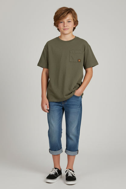 An olive green short-sleeve pocket t-shirt hanging on a white plastic hanger against a textured off-white wall.