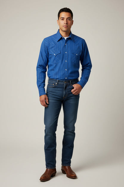 A blue long-sleeve western-style button-up shirt with thin white vertical pinstripes, laid flat on a white wooden table. The shirt has two buttoned chest pockets and is shown hanging on a black hanger