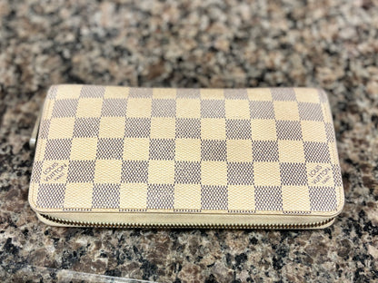 Checkered wallet on a granite surface