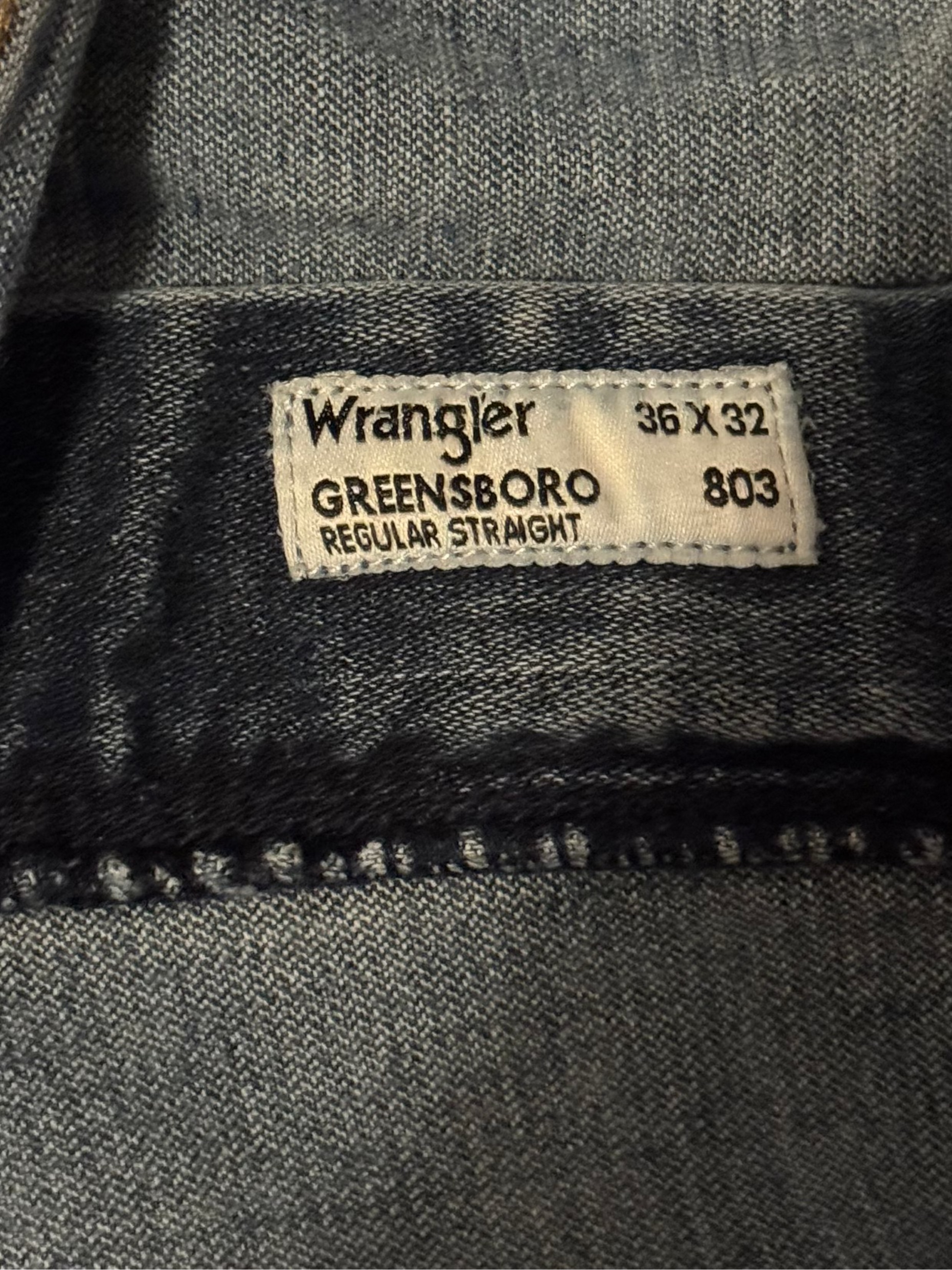 Close-up of a Wrangler label on denim fabric