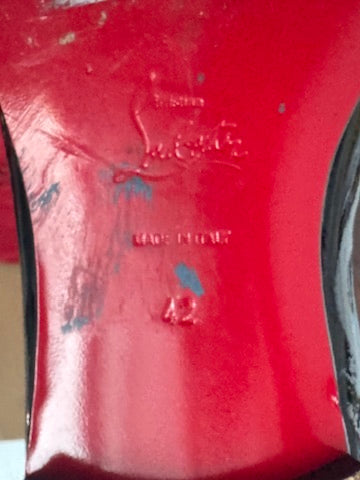 Close-up of a red object with visible branding and text.