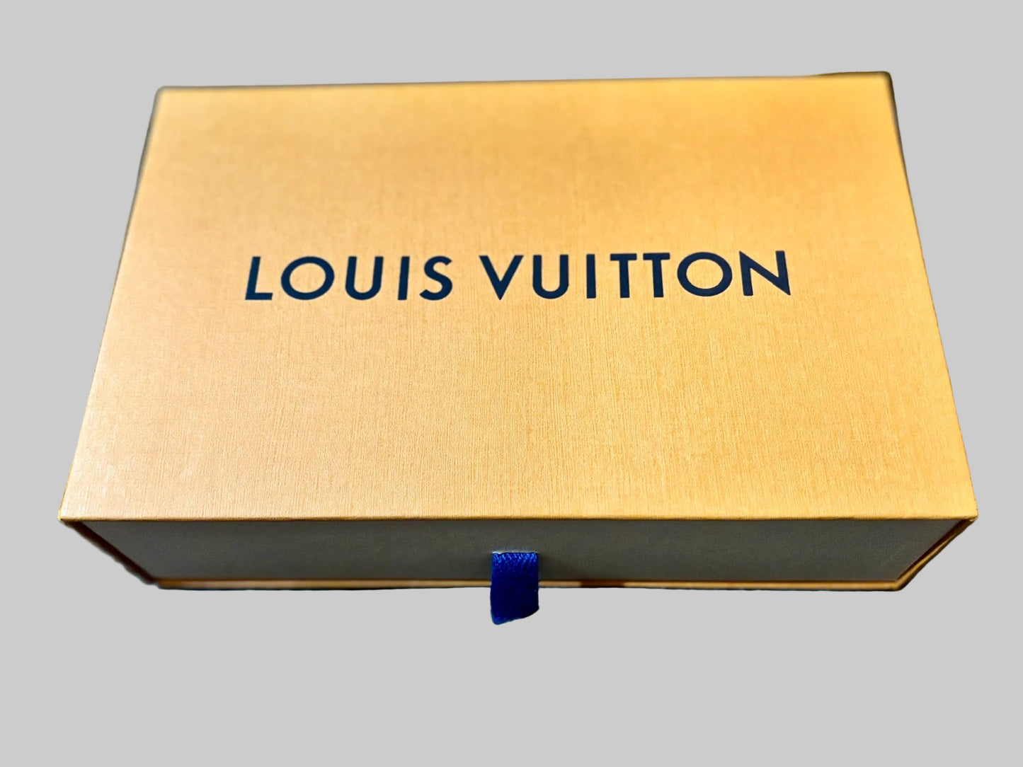 Louis Vuitton box on a blue surface