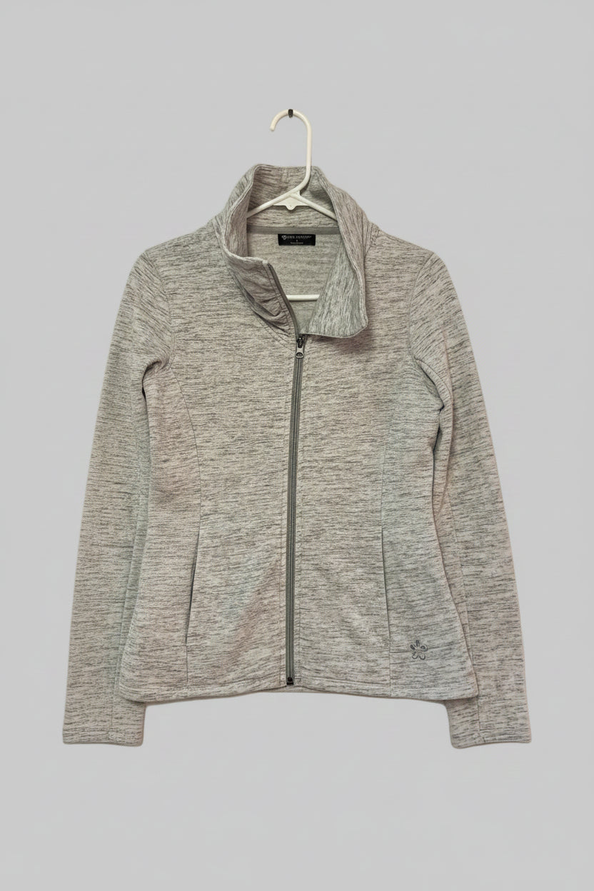Gray zip-up jacket on a hanger against a gray background