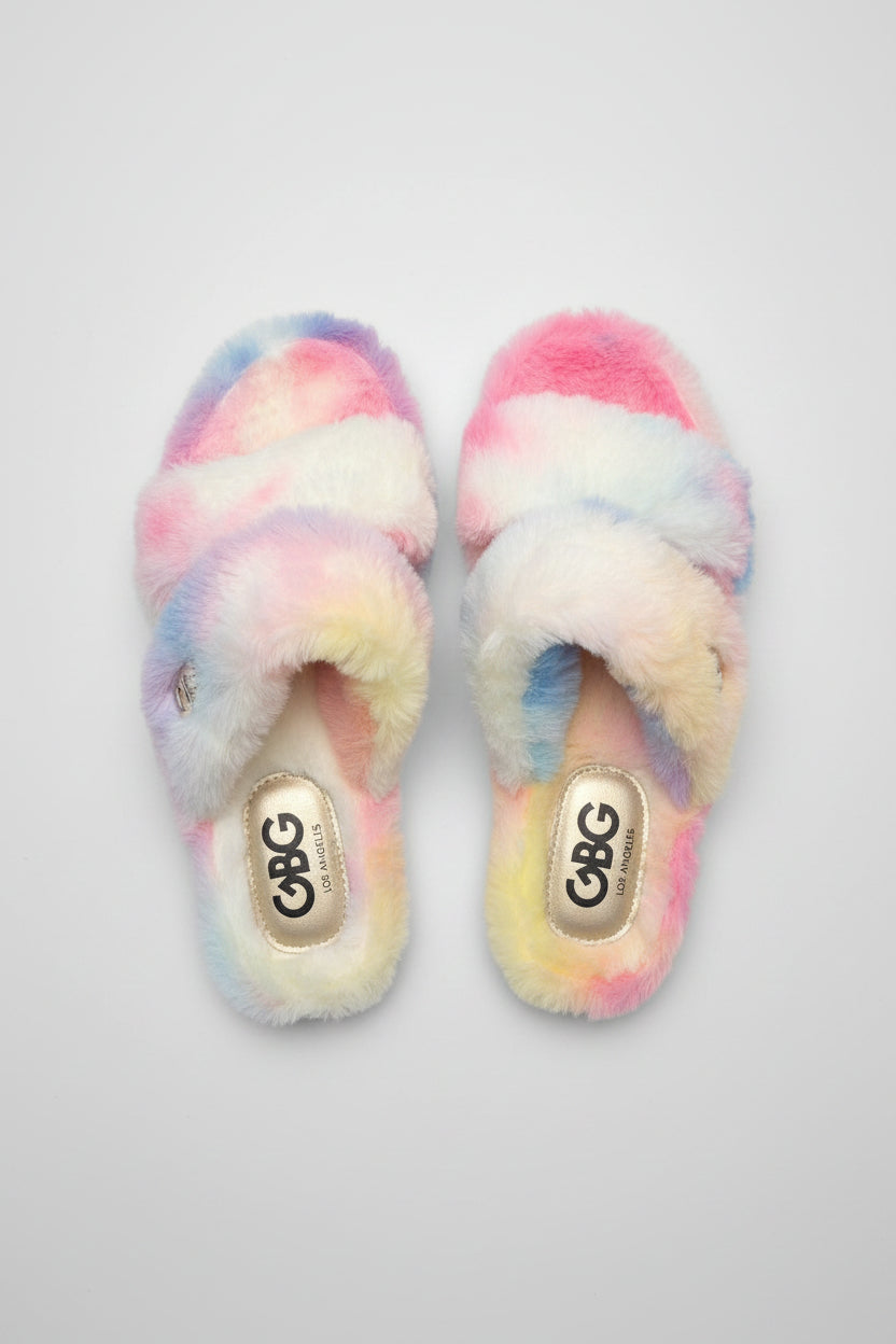 Pair of colorful fuzzy slippers with 'GBG' branding on gray background