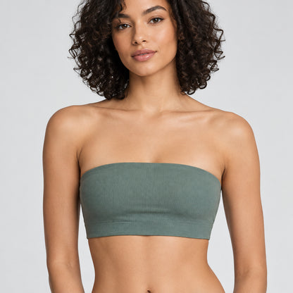 A woman wearing a ribbed strapless bandeau tube top in a muted sage green color, shown from the shoulders to the midriff against a plain light background.