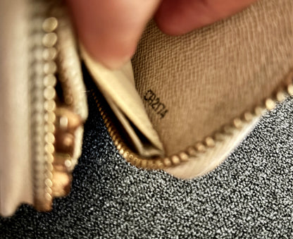 Close-up of a hand holding a textured fabric item with 'Burga' branding.