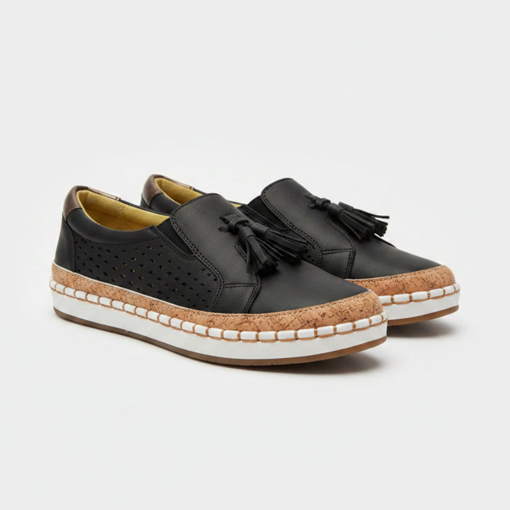 Black shoes with cork sole on a light background