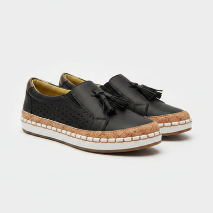 Black shoes with cork sole on a light background
