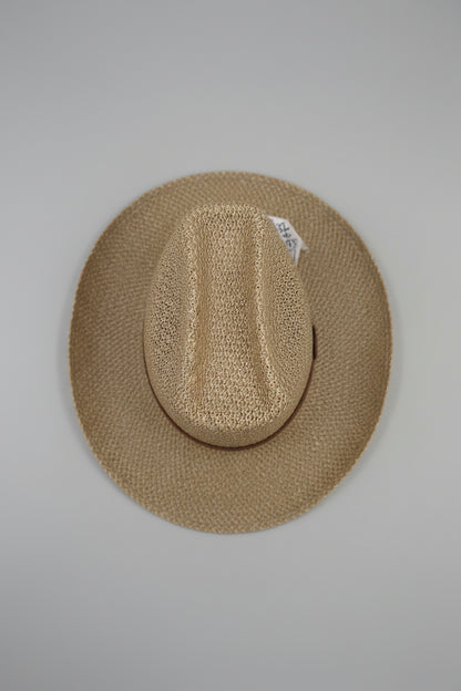 Close-up of a textured brown hat on a neutral background