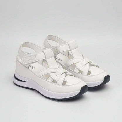 White sandals with 'Fashion' branding on a white background