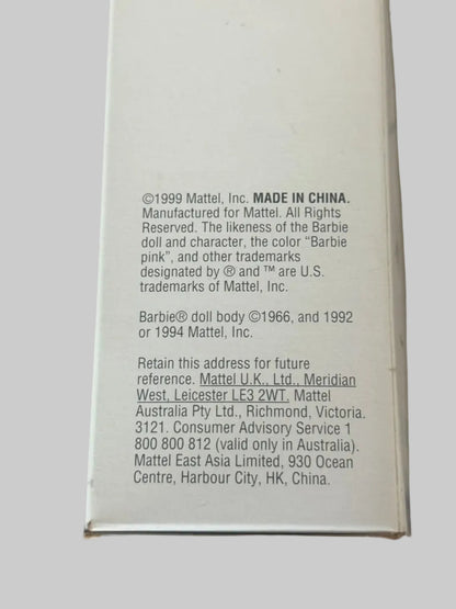 Back of a Barbie doll box with branding and manufacturing information.