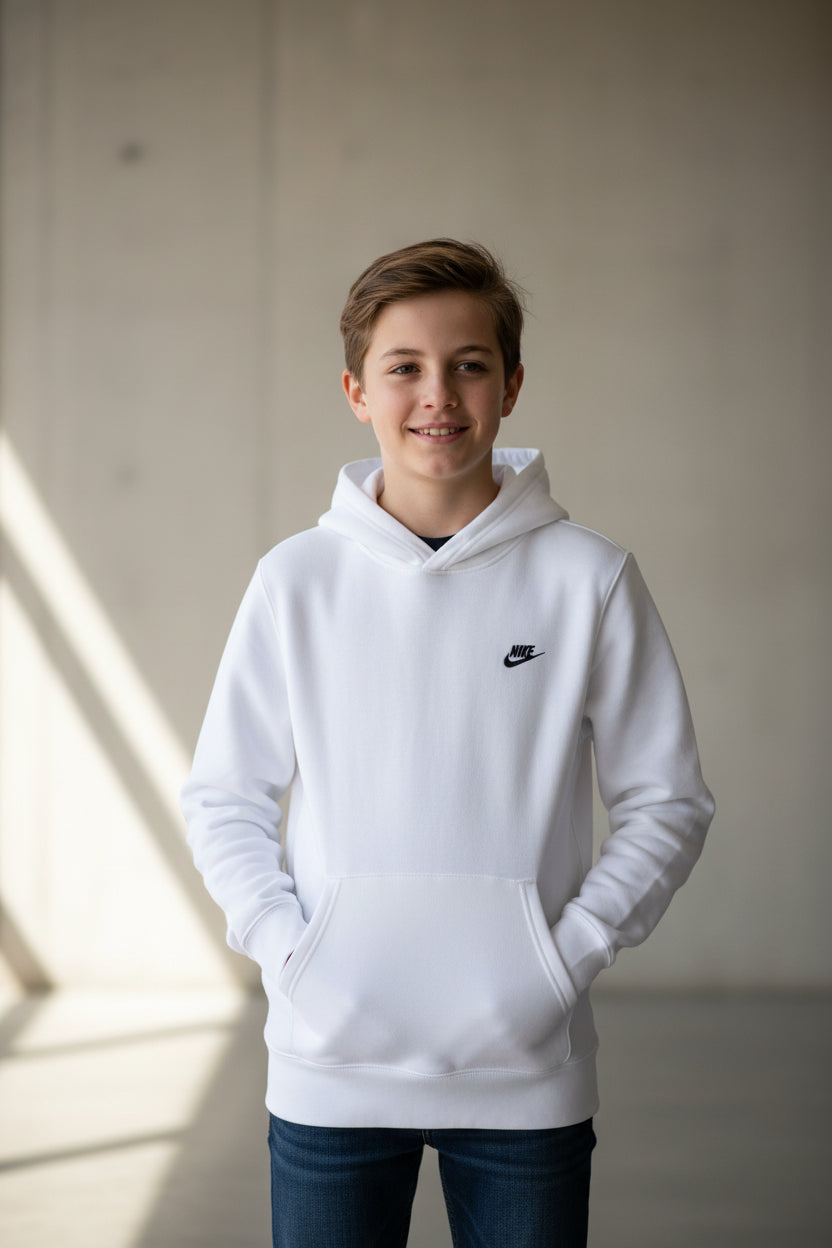A white Nike pullover hoodie with a small black Swoosh logo on the left chest, displayed flat against a solid gray background.