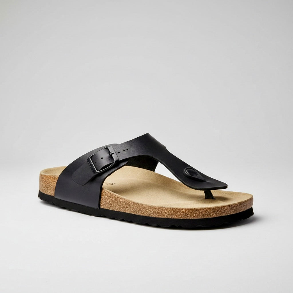 Black sandal with cork sole on a light gray background