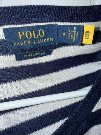 Close-up of Polo Ralph Lauren label on a striped shirt