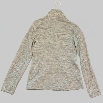 Gray long-sleeve shirt on a hanger against a gray background