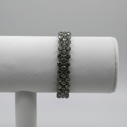 Close-up of a bracelet on a roll on a neutral background