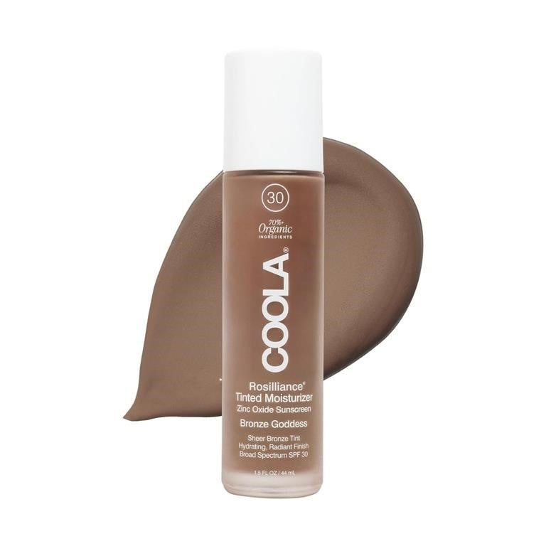 Coola Rosilliance Tinted Moisturizer bottle with a swatch on a white background