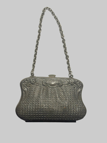 Silver vintage handbag with chain strap on a white background