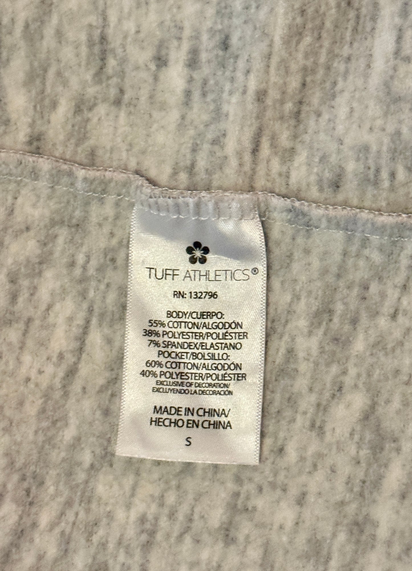 Tuff Athletics label on a textured fabric background