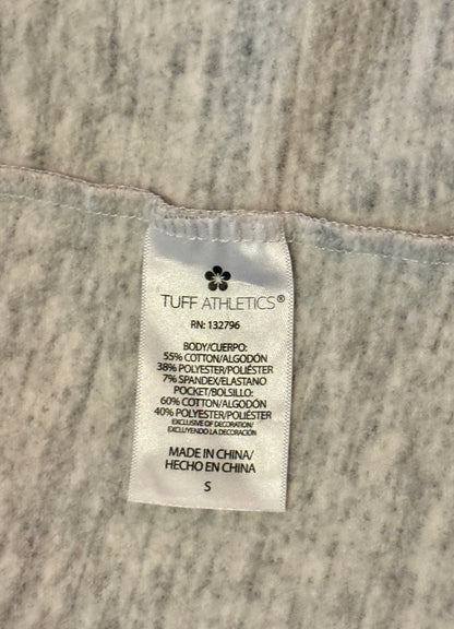 Tuff Athletics label on a textured fabric background