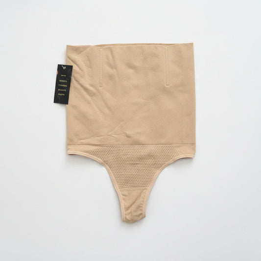 Beige shapewear with textured bottom section on a white background