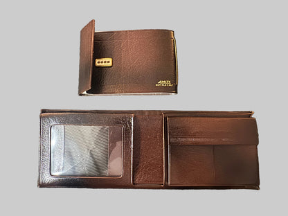 Brown leather wallet with a clear card holder on a textured surface