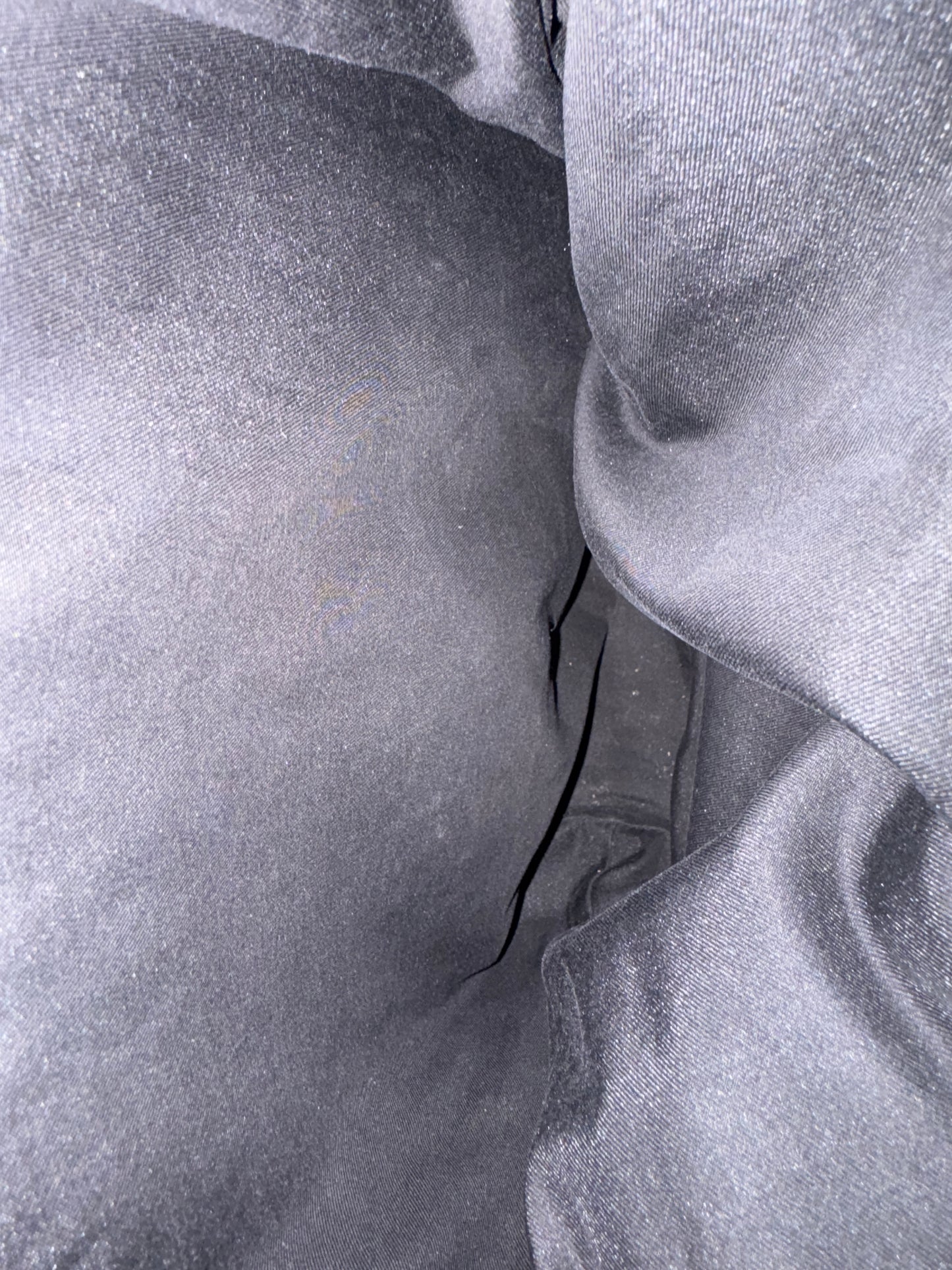 Close-up of textured gray fabric with folds