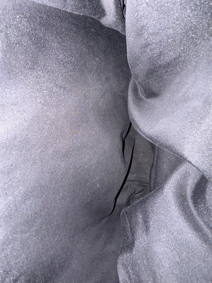 Close-up of textured gray fabric with folds
