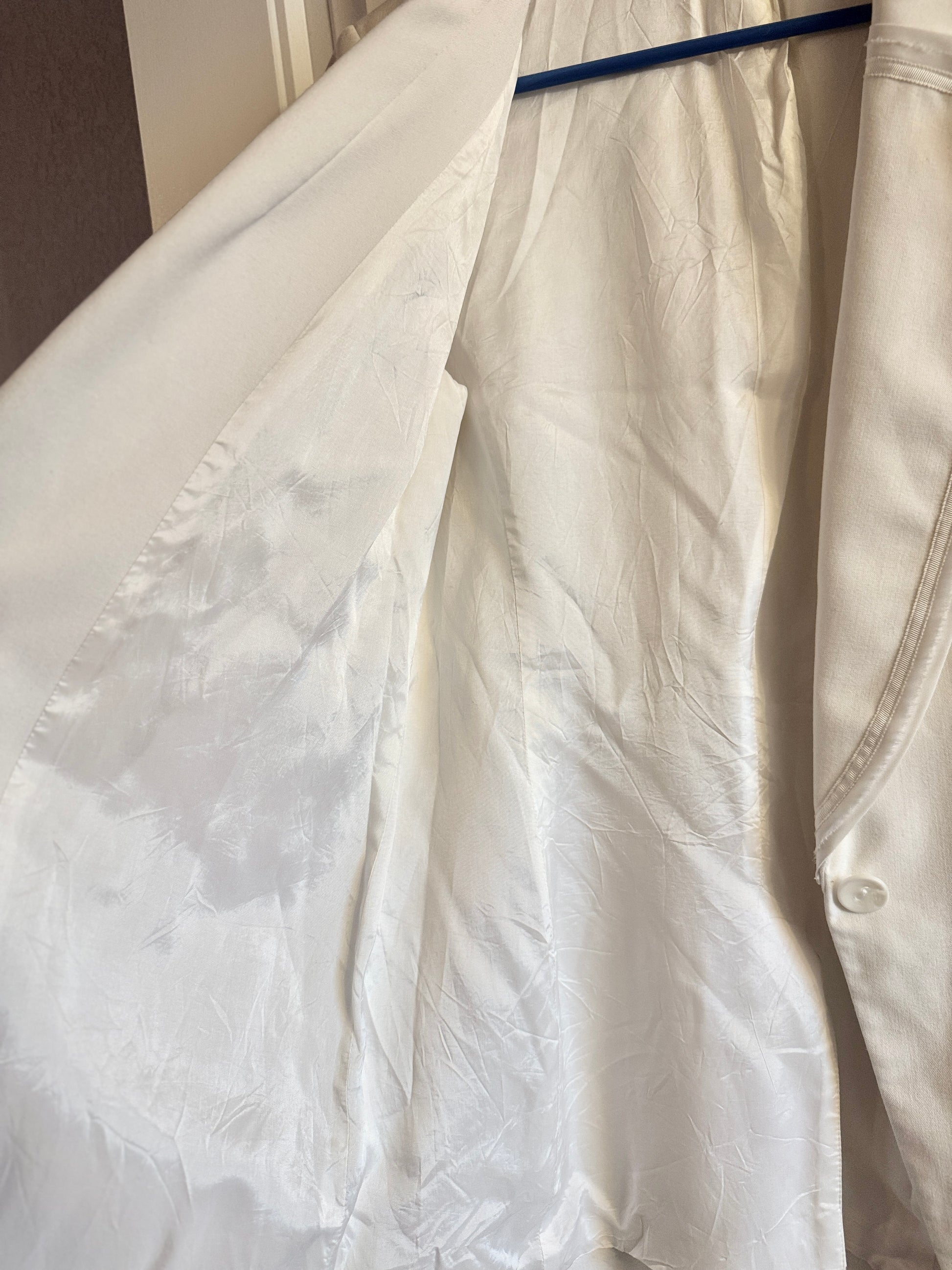 White shirt with a collar on a plain background