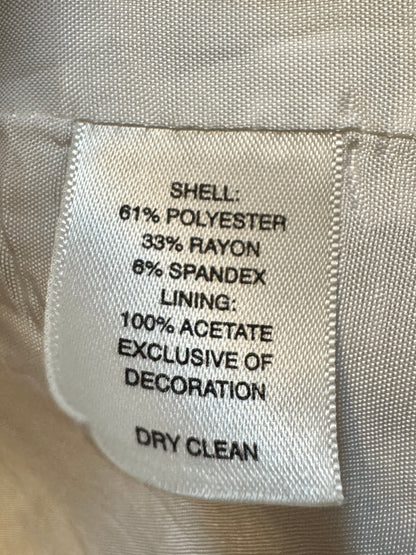 Fabric label with material composition details on a beige fabric background