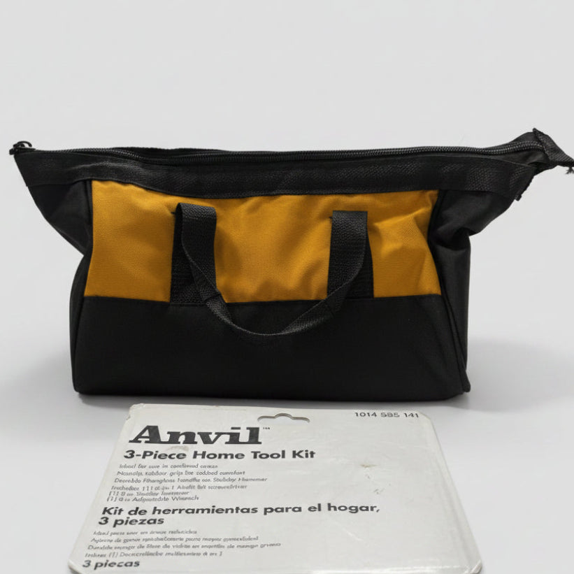 A black and yellow Anvil tool bag sits on a beige carpet in front of its white retail packaging for the Anvil 3-Piece Home Tool Kit.