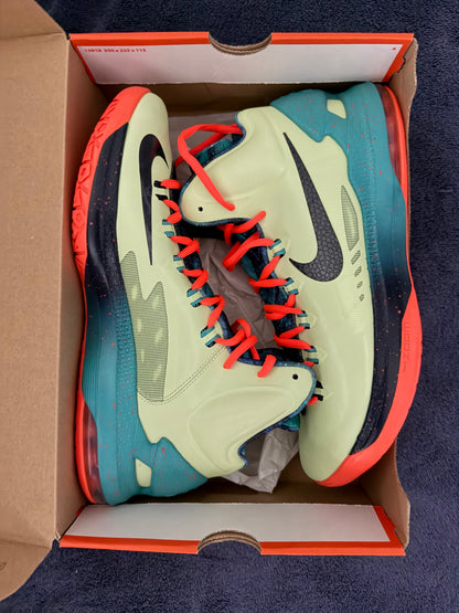 Pair of Nike sneakers in an open box with a dark blue background