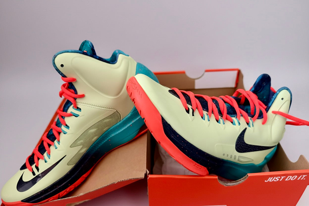Colorful high-top sneakers with a Nike logo on a gray background