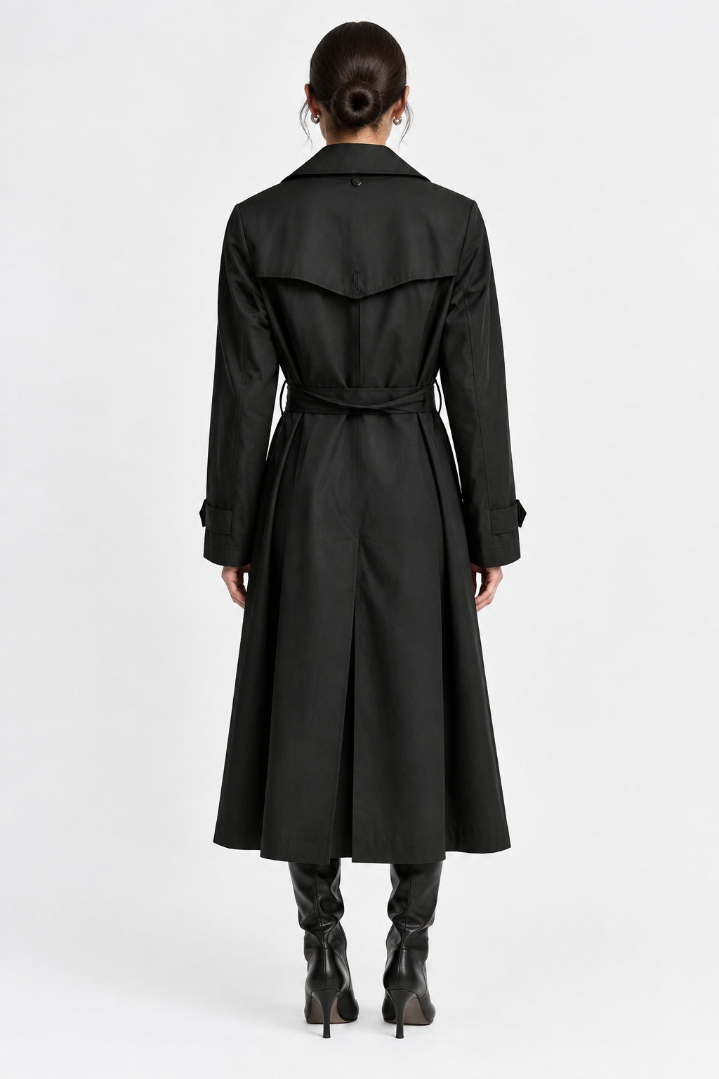 A black trench coat with a matching waist belt, shown from the back on a hanger against a light gray background.