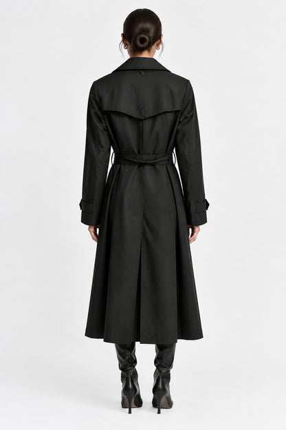 A black trench coat with a matching waist belt, shown from the back on a hanger against a light gray background.