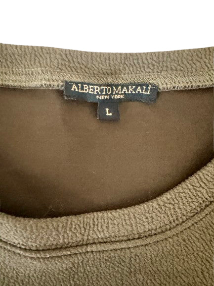 Close-up of a brown fabric with an Alberto Makali label on a white background