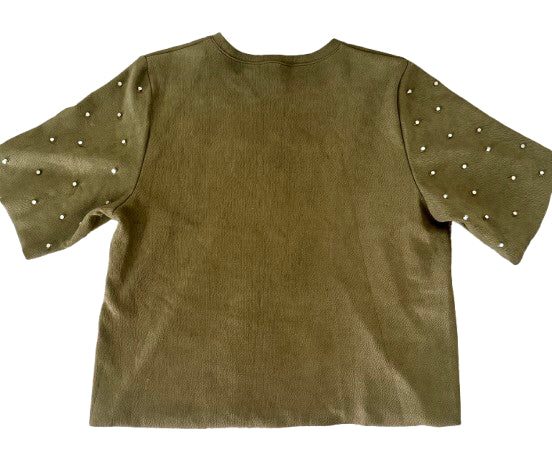 Green shirt with decorative studs on sleeves against a white background