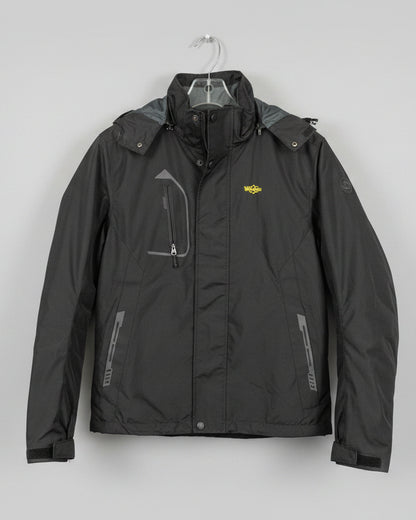 A black zip-up jacket with a small yellow embroidered 'Wiggles' logo on the chest, hanging on a rack in a retail store.