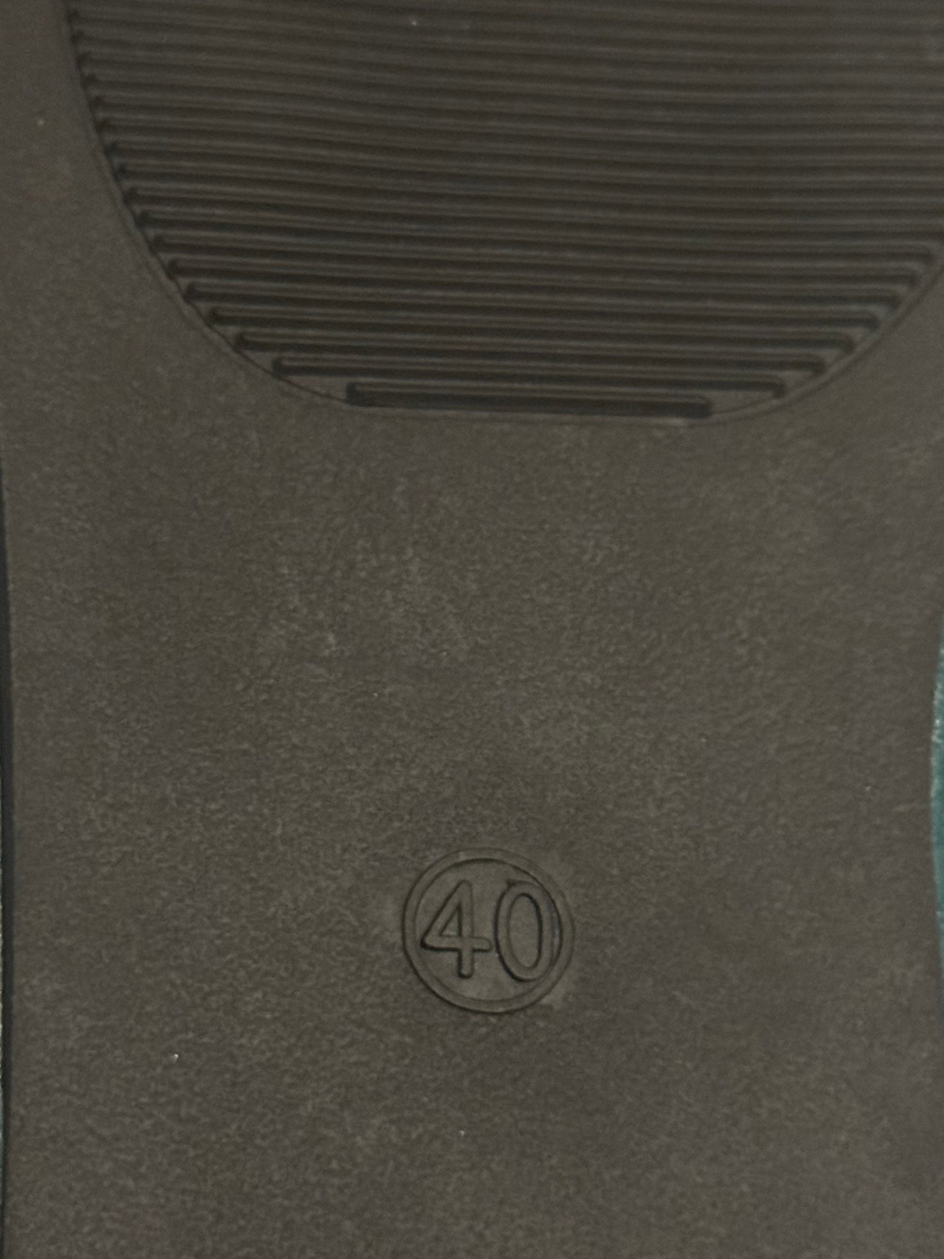 Black car mat with a '40' logo on a textured surface