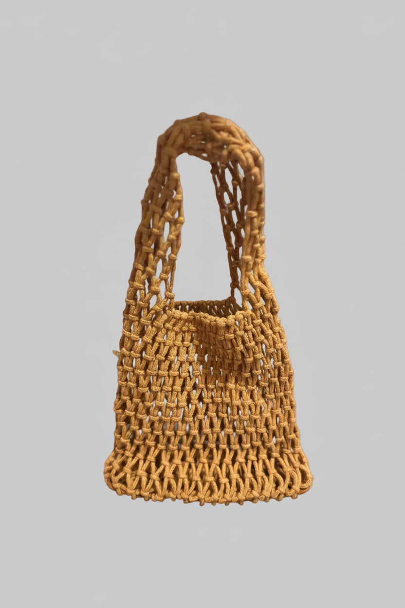 Woven handbag on gray background
