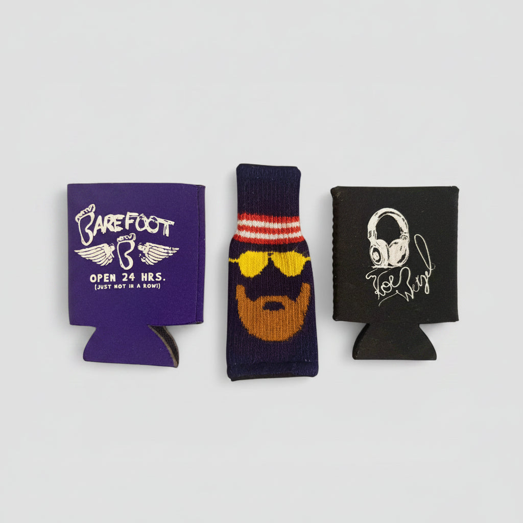 Three can coolers with different designs on a white background