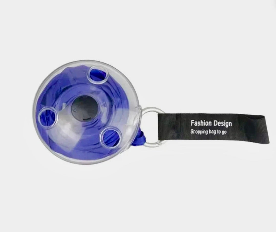 Blue and clear plastic bag with a black strap labeled 'Fashion Design Shopping Bag to Go' on a white background