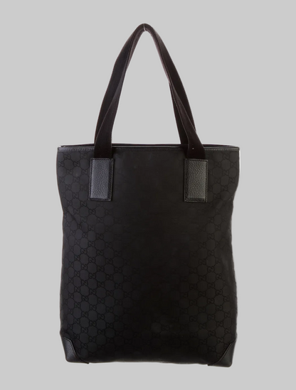 Black quilted tote bag with pattern on a white background