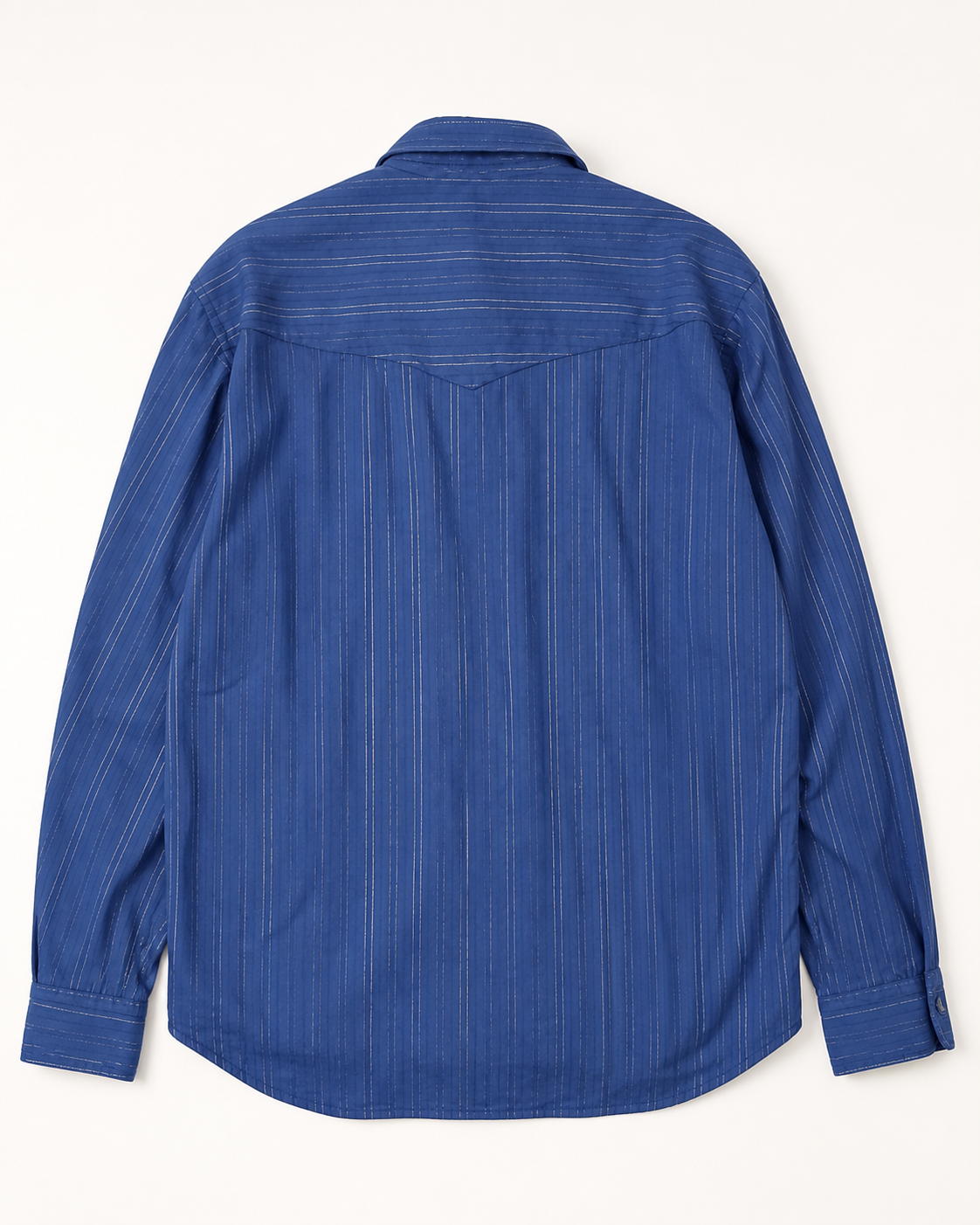 A blue long-sleeve button-up shirt with thin vertical white pinstripes, shown from the back on a light cream background.