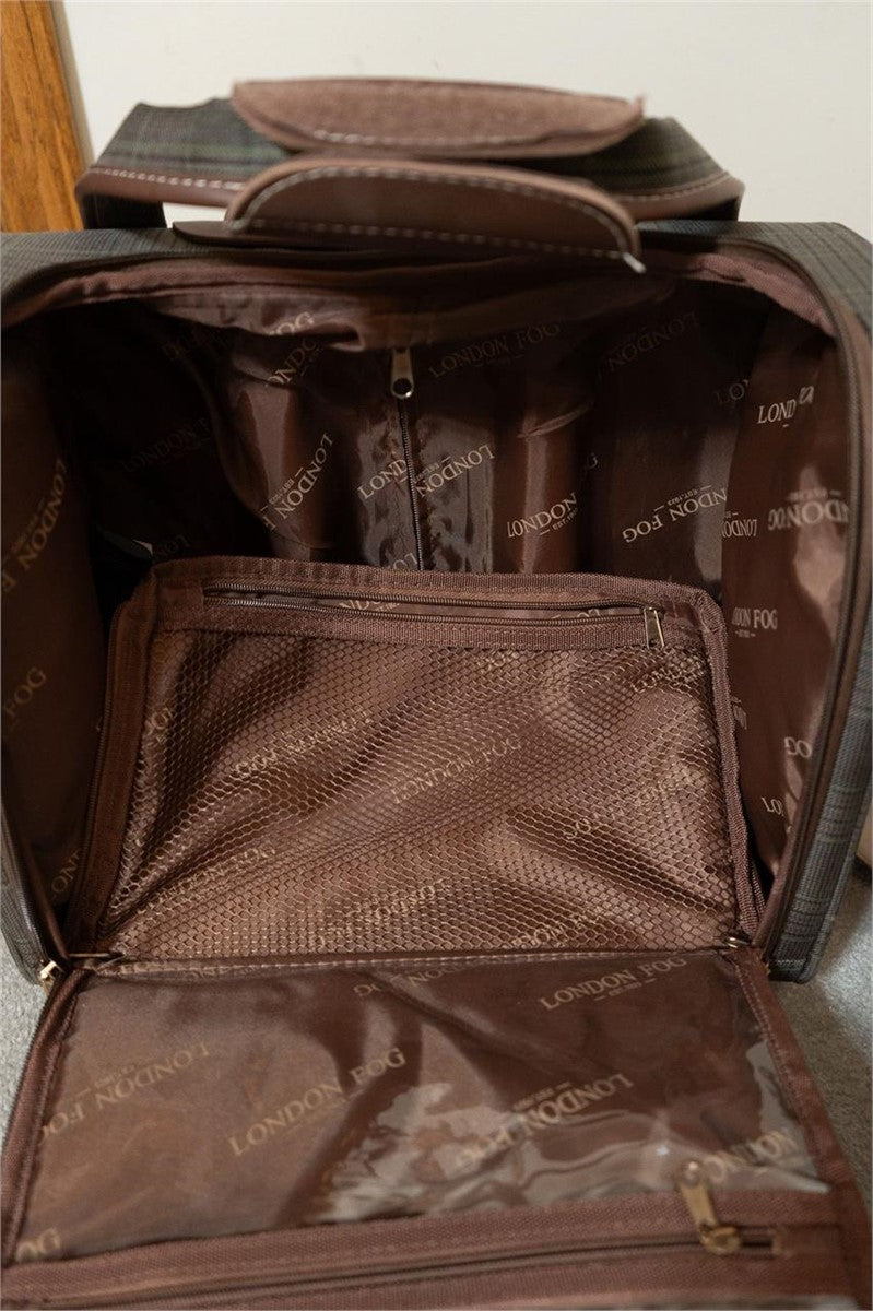 An open brown leather or faux-leather bag showing the interior compartments, mesh pockets, and branded lining. The lining has a repeating 'LONDON FOX' pattern.