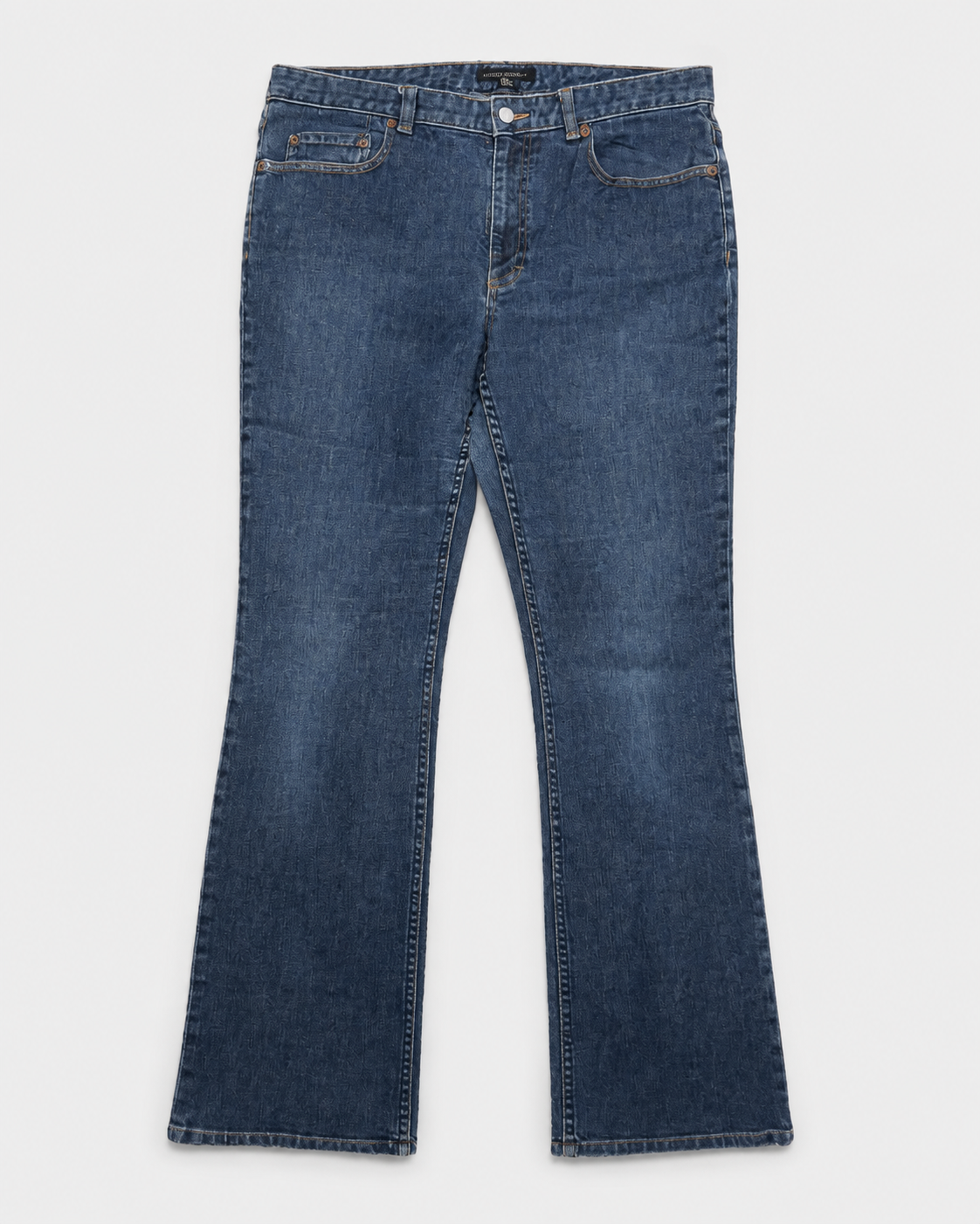 A pair of dark blue denim jeans with a straight-leg or bootcut fit, laid flat against a light gray background.